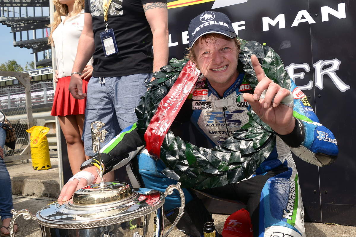 Ivan Lintin celebrating his lightweight TT win