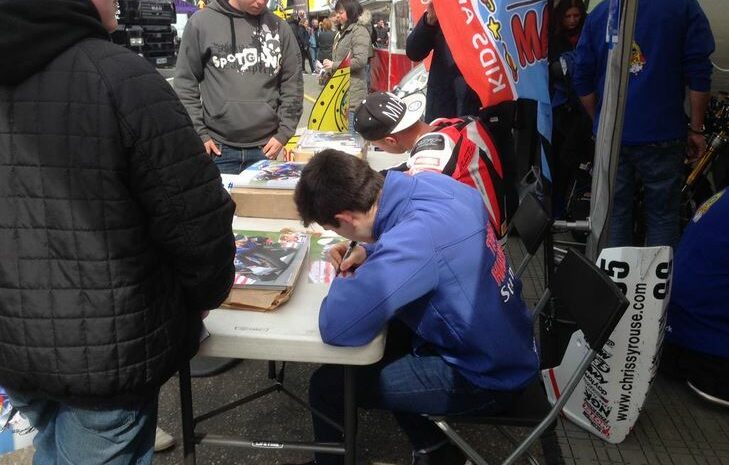 signing autographs at Brands