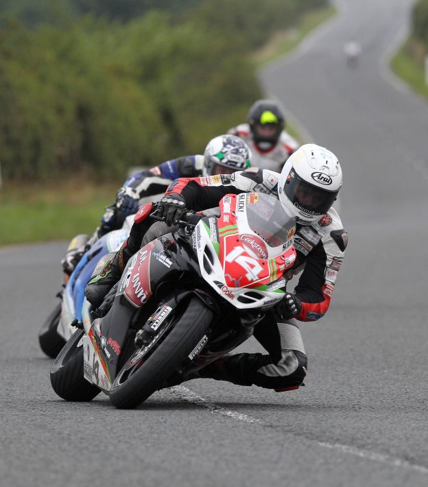 PACEMAKER, BELFAST, 16/8/2014: Dan Kneen (Cookstown Burrows Suzuki) leads Dean Harrison (RC Express Kawasaki) and Bruce Anstey (Valvoline Pafgetts Honda) through Tournagrough on his way to victory in the Superstock race at the Ulster Grand Prix at Dundrod today. PICTURE BY STEPHEN DAVISON