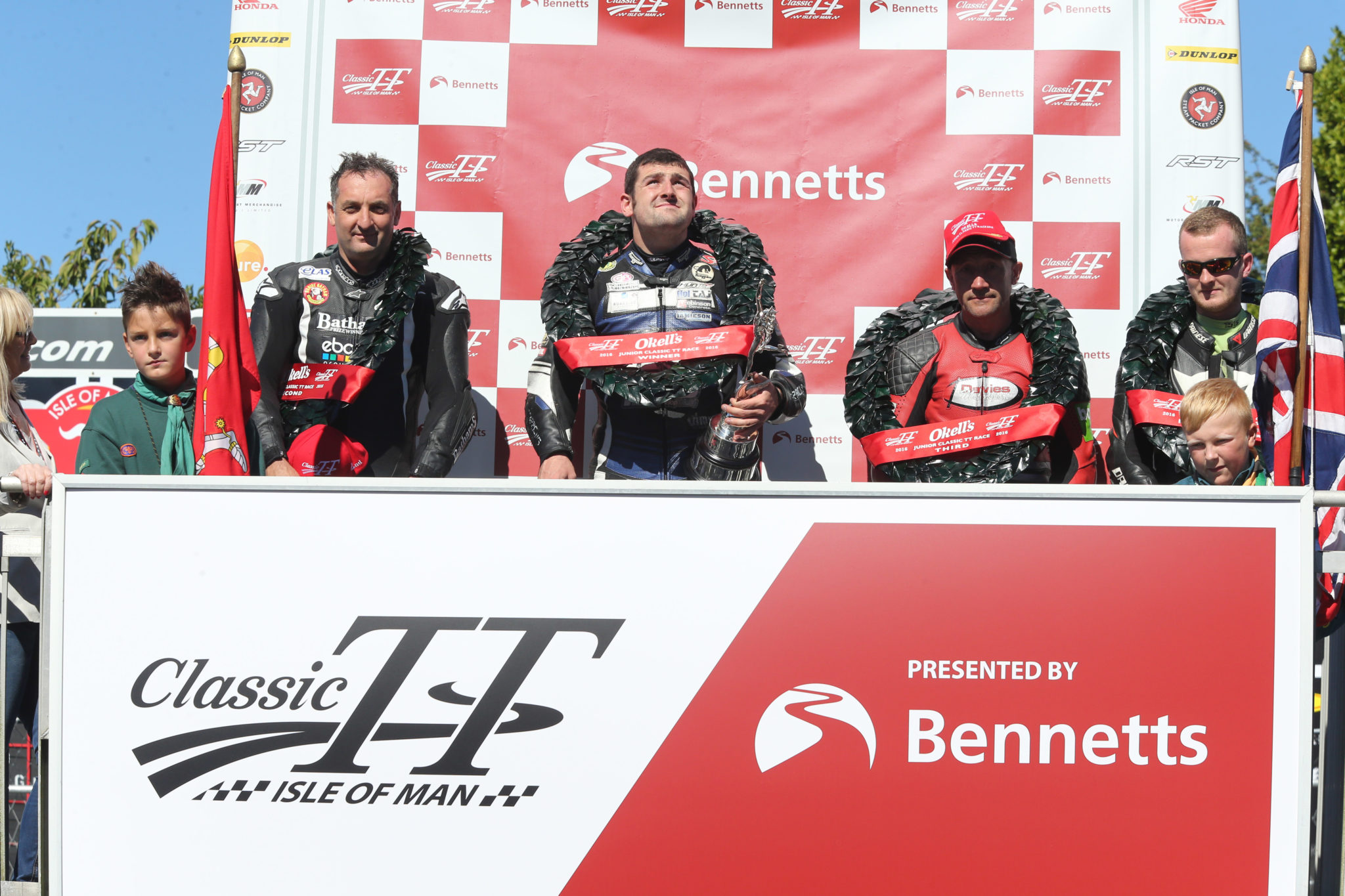 PACEMAKER, BELFAST, 29/8/2016: Michael Dunlop (Black Eagle MV Agusta) celebrates winning the 350cc race at the Classic TT today with runner up Michael Rutter and third placed Alan Oversby. PICTURE BY STEPHEN DAVISON