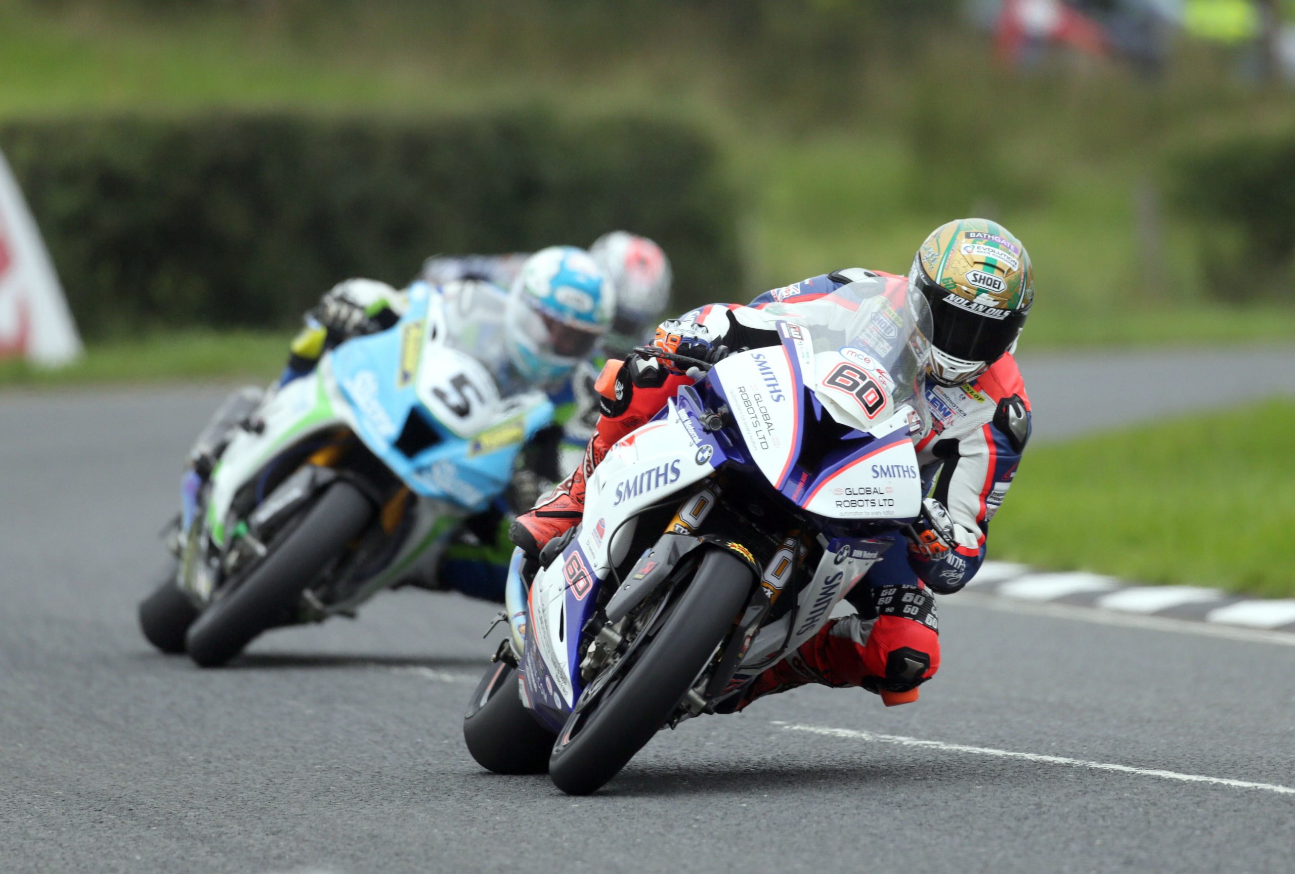 Peter Hickman (Smiths BMW) and Dean Harrison (Silicone Kawasaki) through Quarry Bends during the Superbike race at the Ulster Grand Prix today. The race was stopped twice following a crash and rain disruption.
