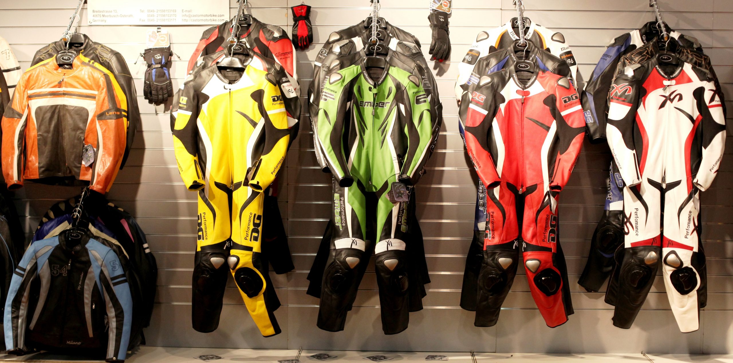 Motorcycle leathers hanging in shop